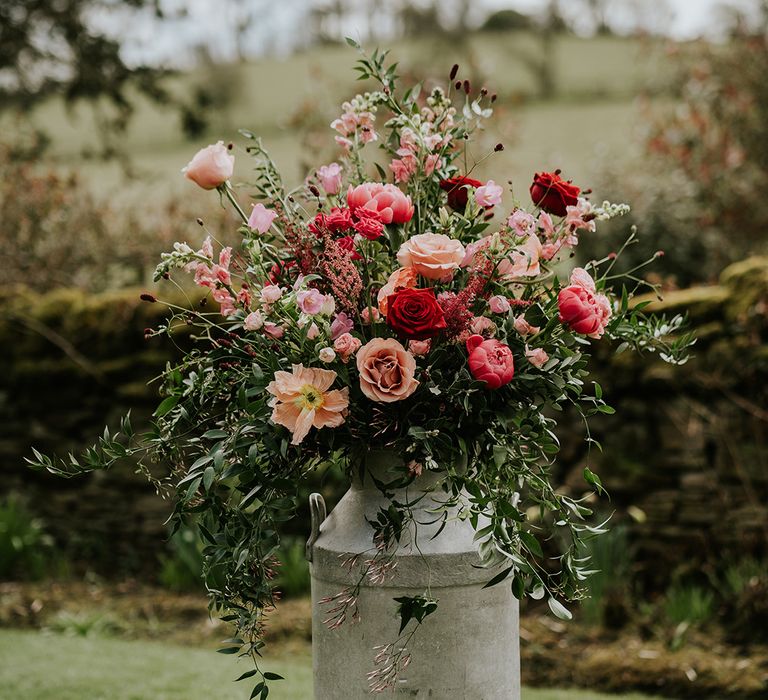 pink-wedding-flowers-in-milk-churn