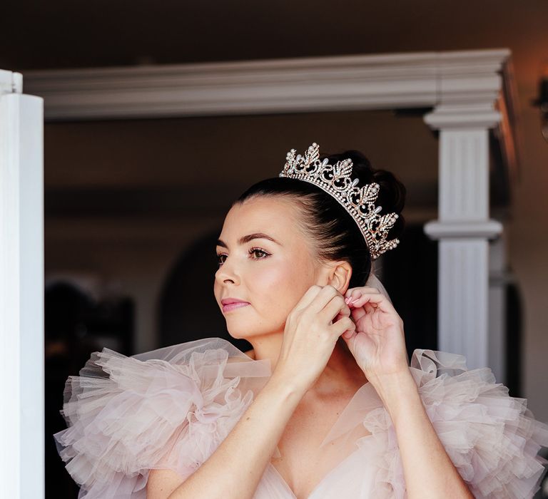 bride-in-pink-ruffle-wedding-dress-with-crown