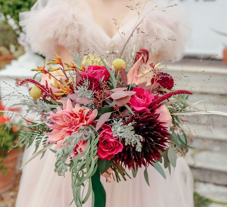 bride-in-pink-ruffle-wedding-dress-with-pink-bouquet