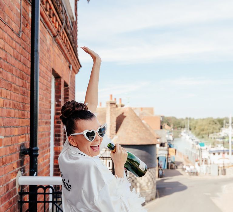 bride-in-white-robe-with-sunglasses