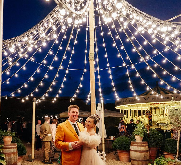 couple-portrait-under-festoon-lights