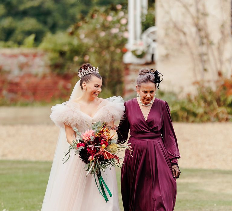 mother-of-the-bride-purple-dress-walks-bride-down-aisle