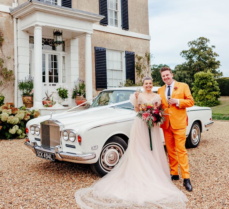 vintage-luxe-white-wedding-car-at-preston-court-wedding-venue