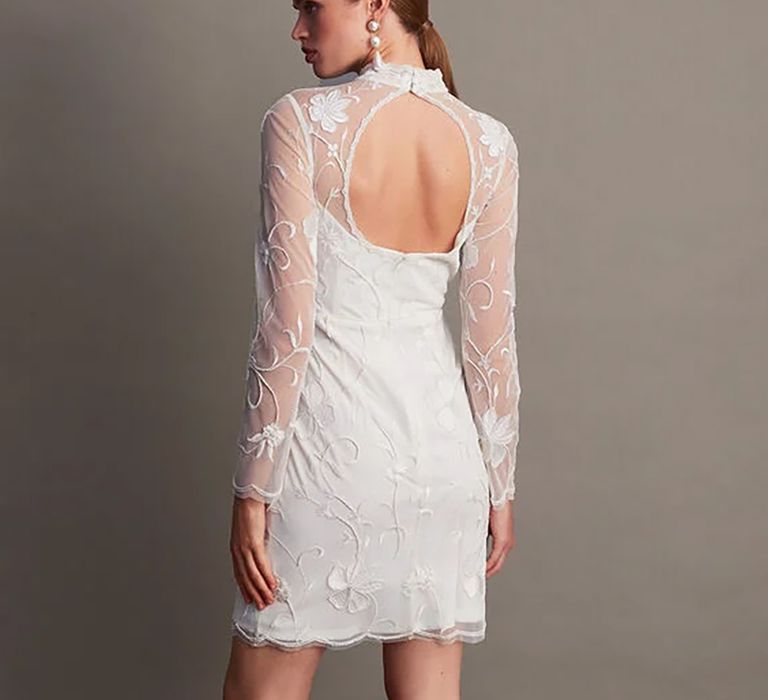 Back view of embroidered short budget friendly wedding dress with mesh sleeves from Monsoon