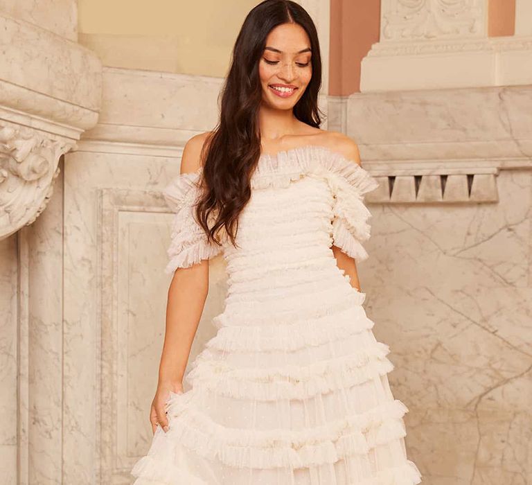 Front view of off-shoulder ruffle budget wedding dress from Needle & Thread