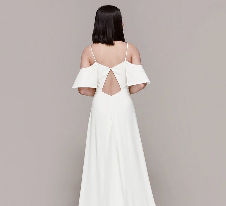 Back view of budget friendly wedding dress with floating bardot sleeves and small train from Whistles