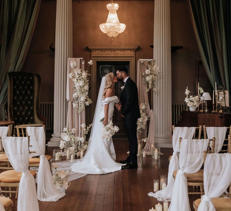 bride-and-groom-kiss-at-elopement-wedding-at-howsham-hall