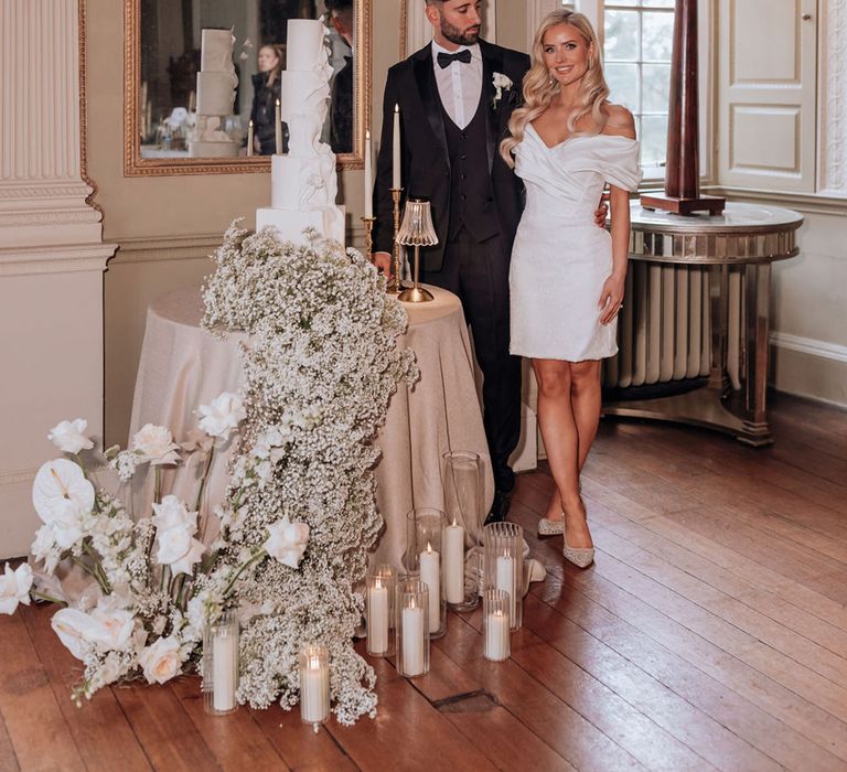 bride-in-short-wedding-dress-with-groom-and-wedding-cake