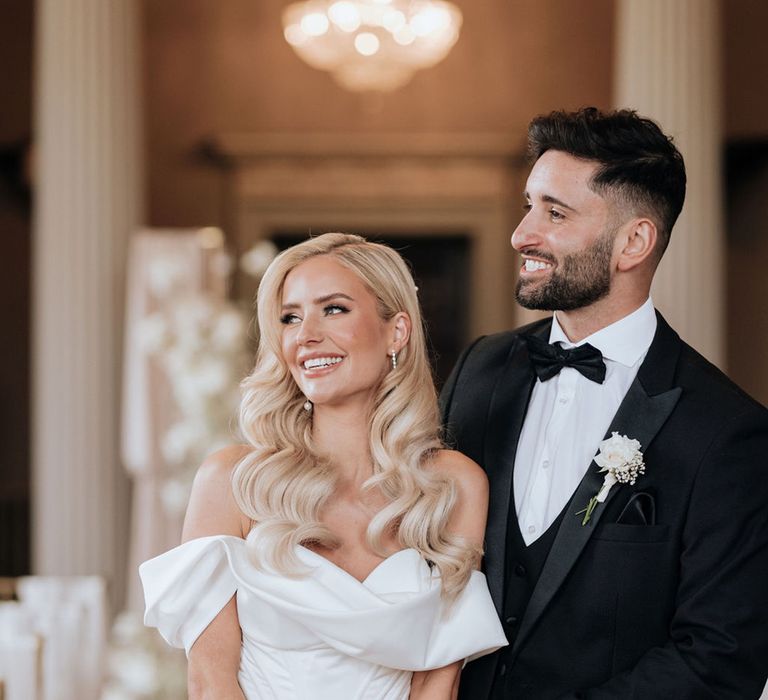 hollywood-glam-wedding-with-bride-in-off-the-shoulder-wedding-dress-with-groom-in-black-tuxedo