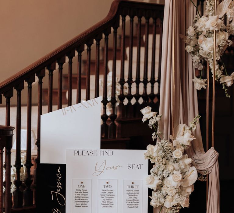 minimalist-monochrome-wedding-seating-chart-with-drapery