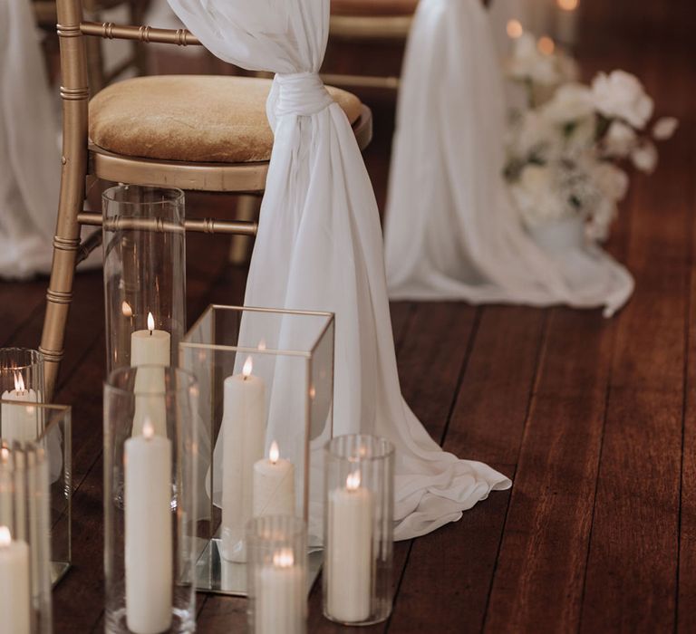 pillar-candles-in-square-hurricane-vases-with-white-drapery