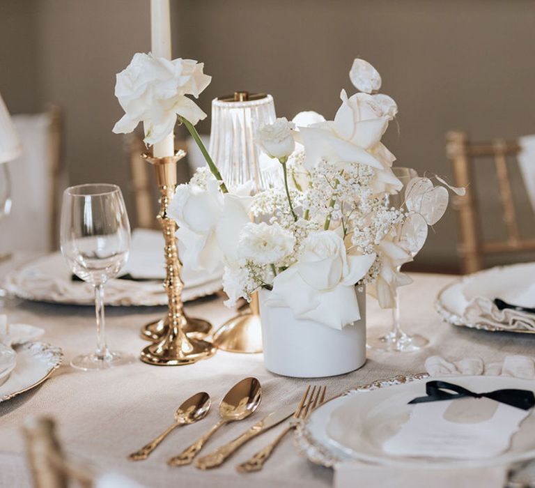 white-wedding-theme-with-gold-candleholders