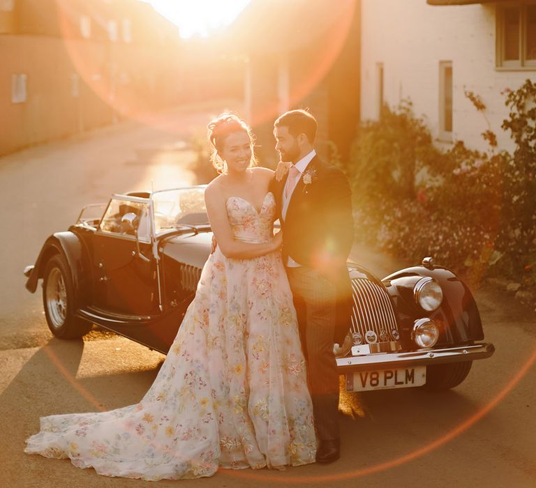 bride-and-groom-with-classic-wedding-car