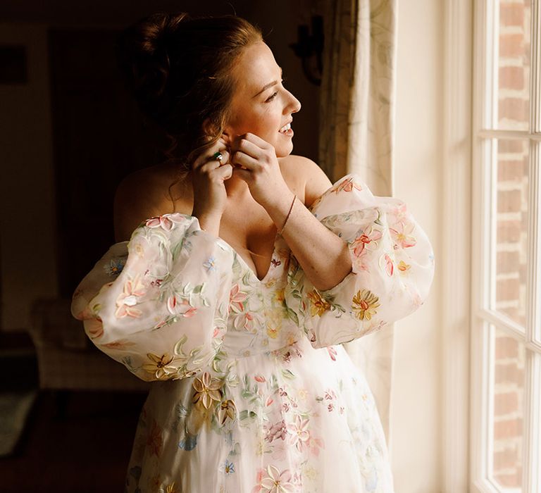 bride-wearing-puff-sleeve-wedding-dress-with-flowers