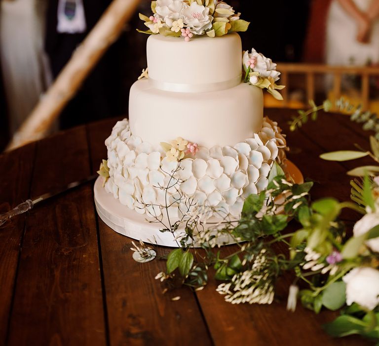 three-tier-white-wedding-cake-with-flowers