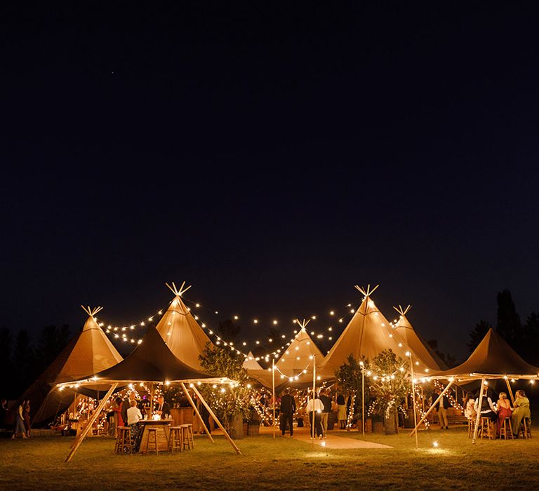 tipi-lit-up-at-nighttime