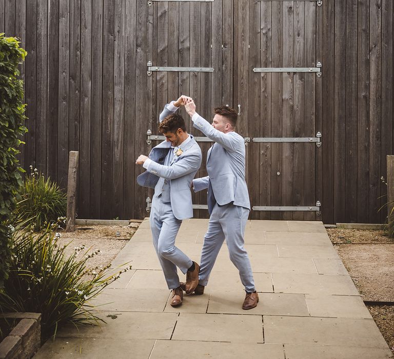 grooms-wearing-light-blue-wedding-suits-at-gay-wedding