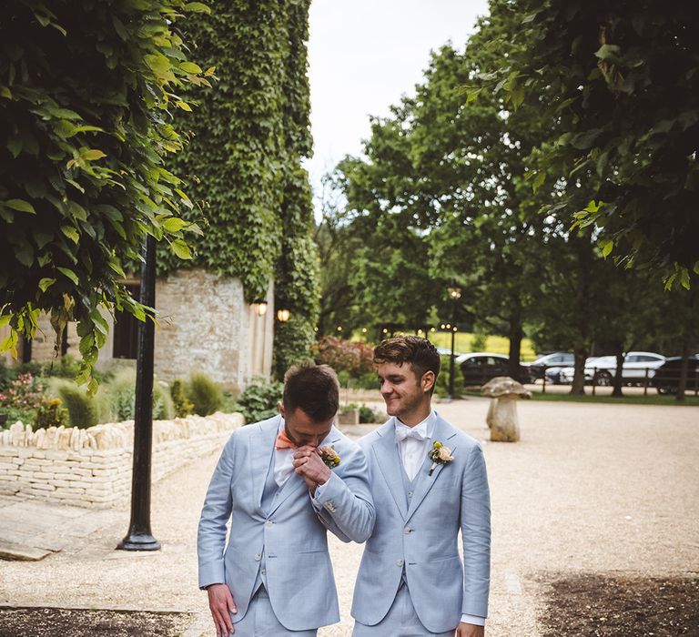 same-sex-gay-wedding-with-two-grooms-dancing-in-light-blue-wedding-suits