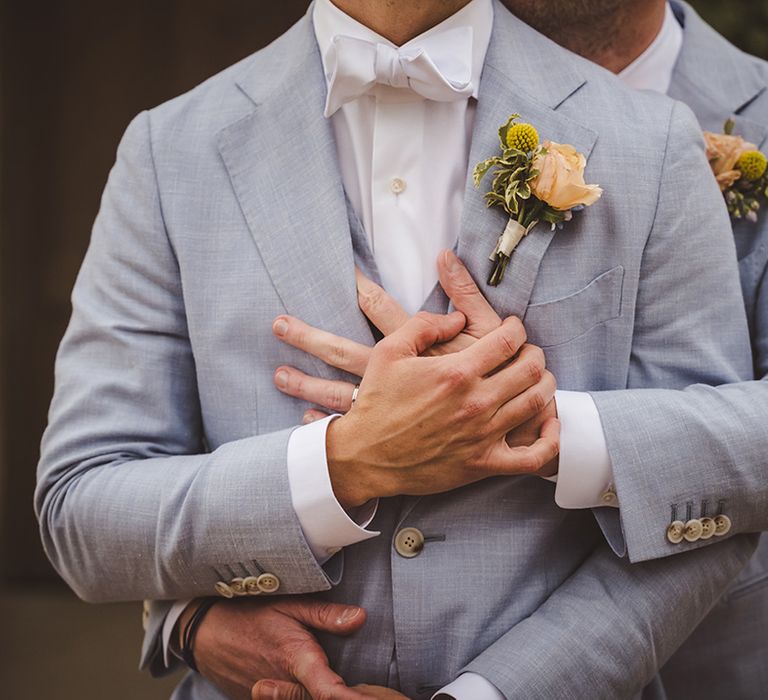 the-grooms-embrace-at-gay-same-sex-wedding