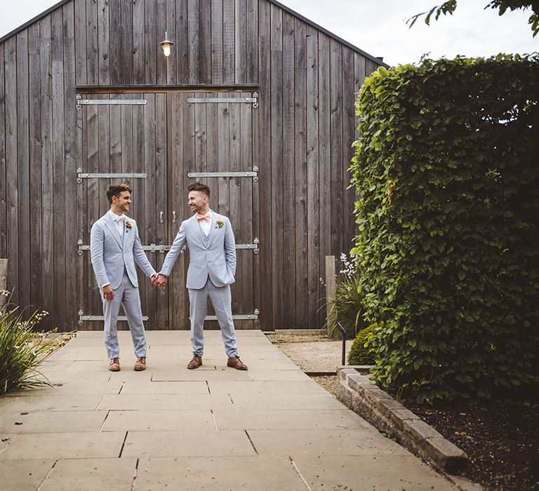 two-grooms-in-light-blue-wedding-suits-at-gay-wedding