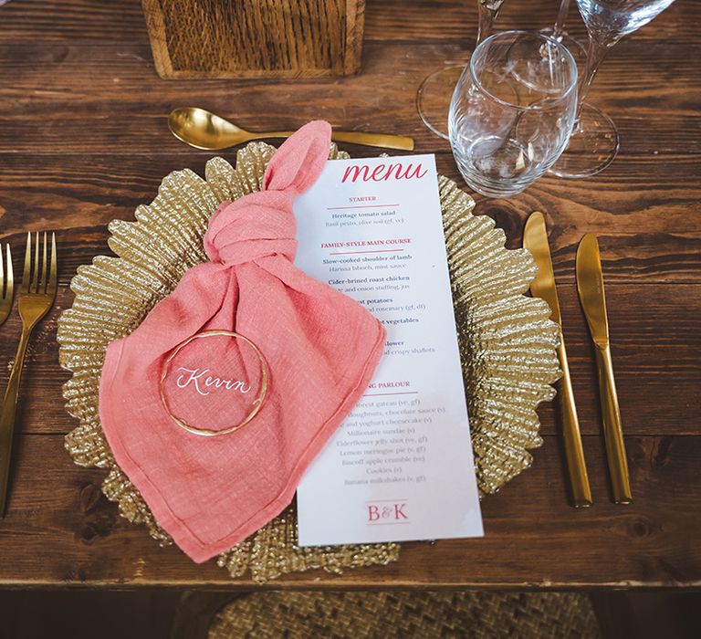 wedding-menu-stationery-with-gold-place-names-and-pink-napkin