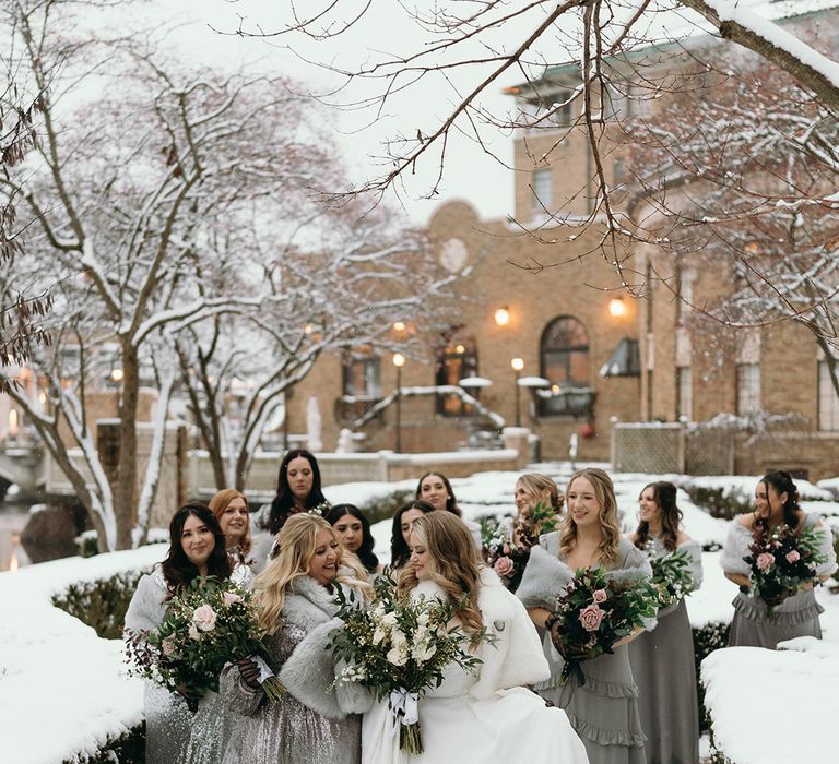 bridal-party-wearing-silver-bridesmaid-dresses-with-shawls-with-bride