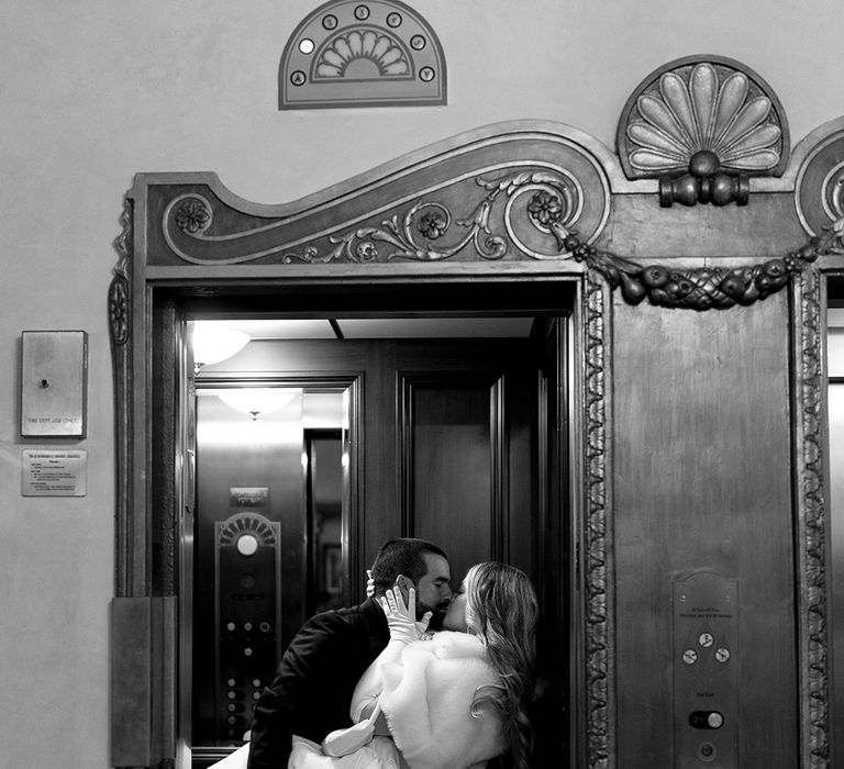 bride-and-groom-kiss-in-lift