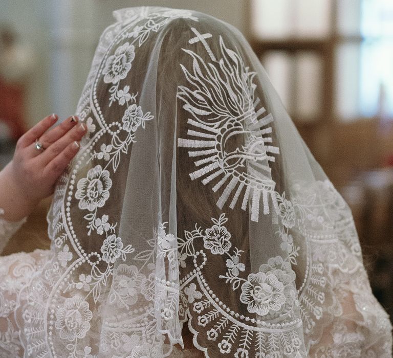 bride-wearing-short-embroidered-wedding-veil