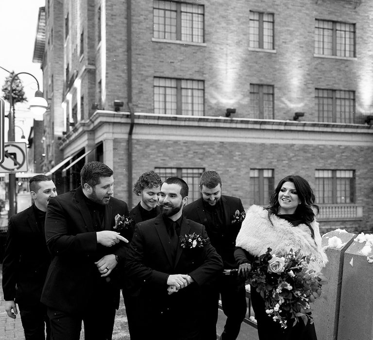 groom-with-groomsmen-and-groomswoman-in-black-outfits