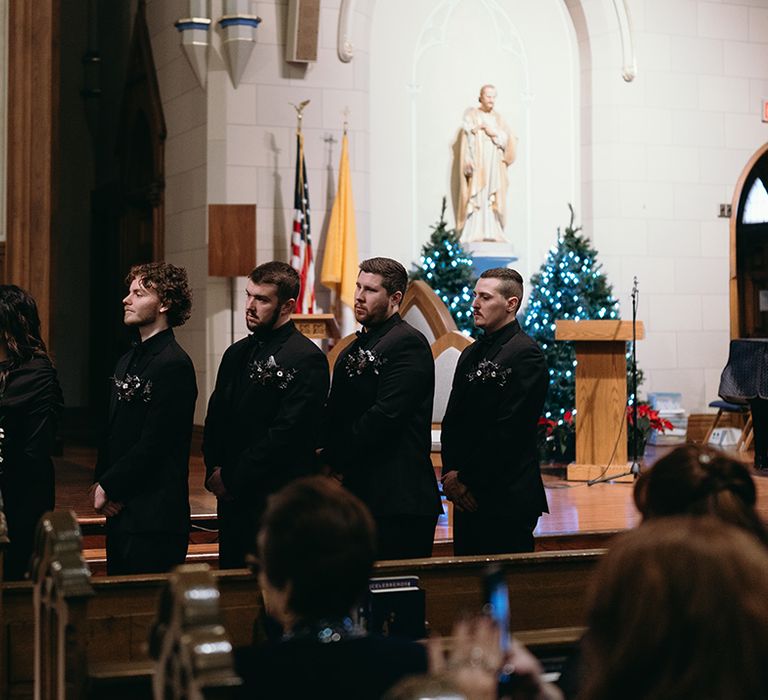 groomsmen-and-groomswoman-wearing-black-suits