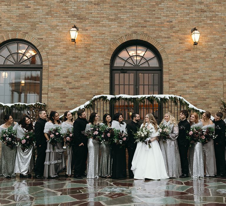 large-wedding-party-attending-winter-wedding