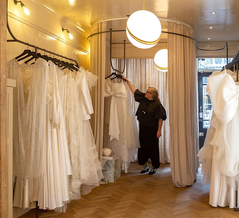 Halfpenny London designer and founder Kate Halfpenny in flagship London boutique with wedding dress collection