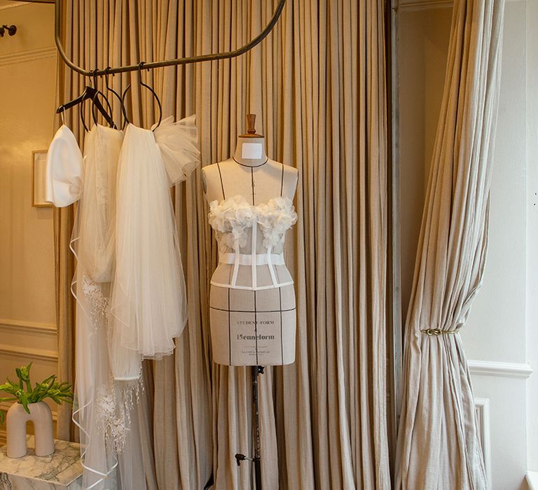 Halfpenny London bespoke wedding dress design process with dress on mannequin