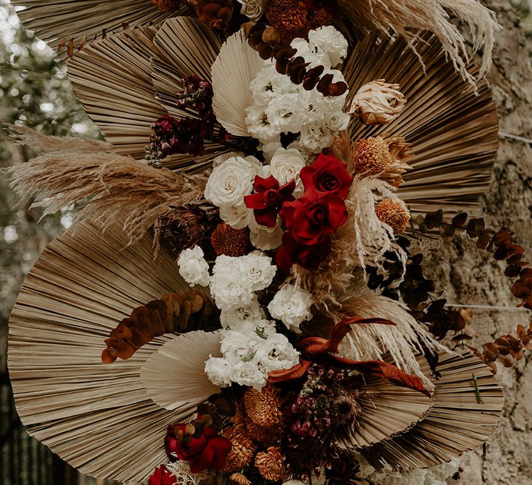 dried-palm-leaves-with-red-and-white-roses