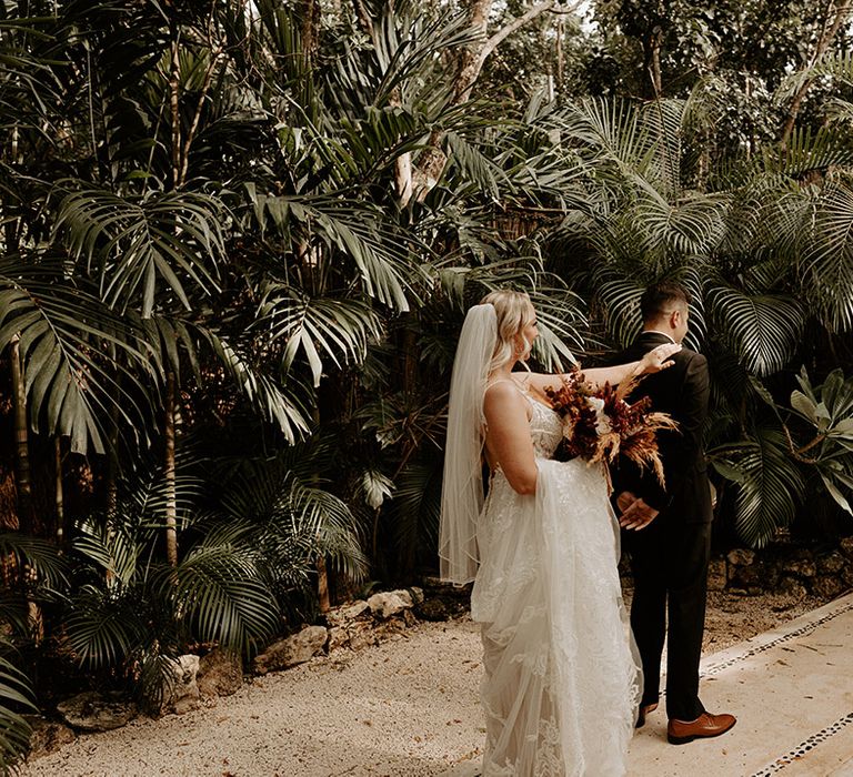 first-look-moment-between-bride-and-groom-at-tulum-destination-wedding