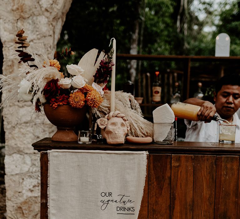 wedding-bar-with-boho-decor-and-drinks-menu