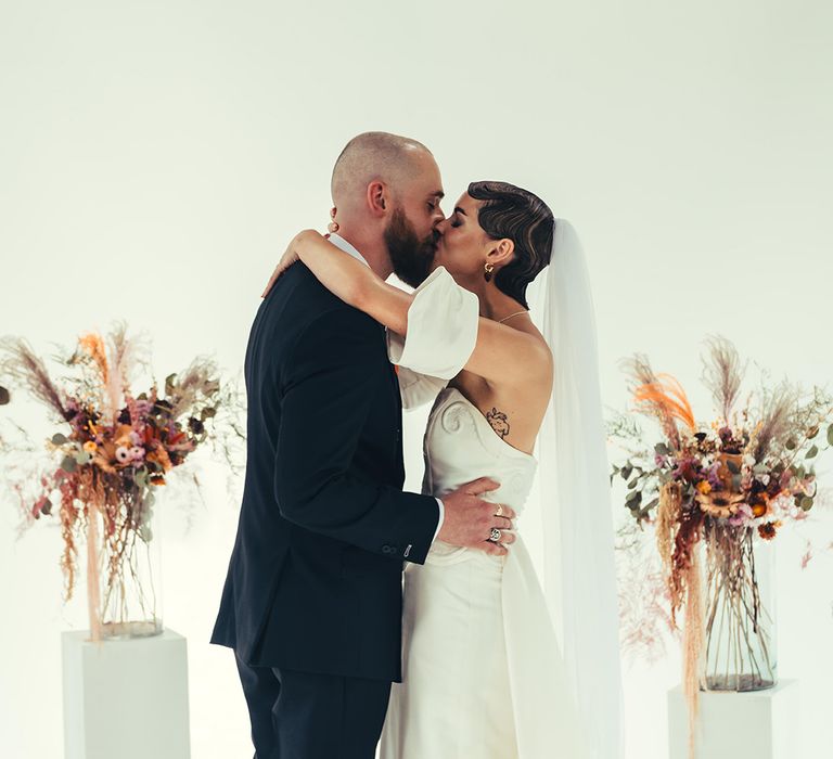 first-kiss-for-bride-and-groom-at-loft-studios