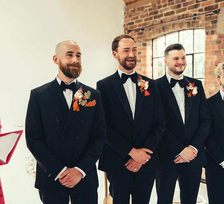 groom-and-groomsmen-see-the-bride-for-the-first-time