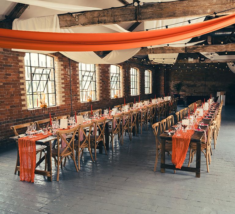 orange-and-white-wedding-drapery-at-industrial-wedding-venue