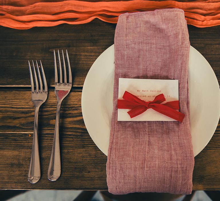 pink-napkin-with-wedding-place-name-on-place-setting