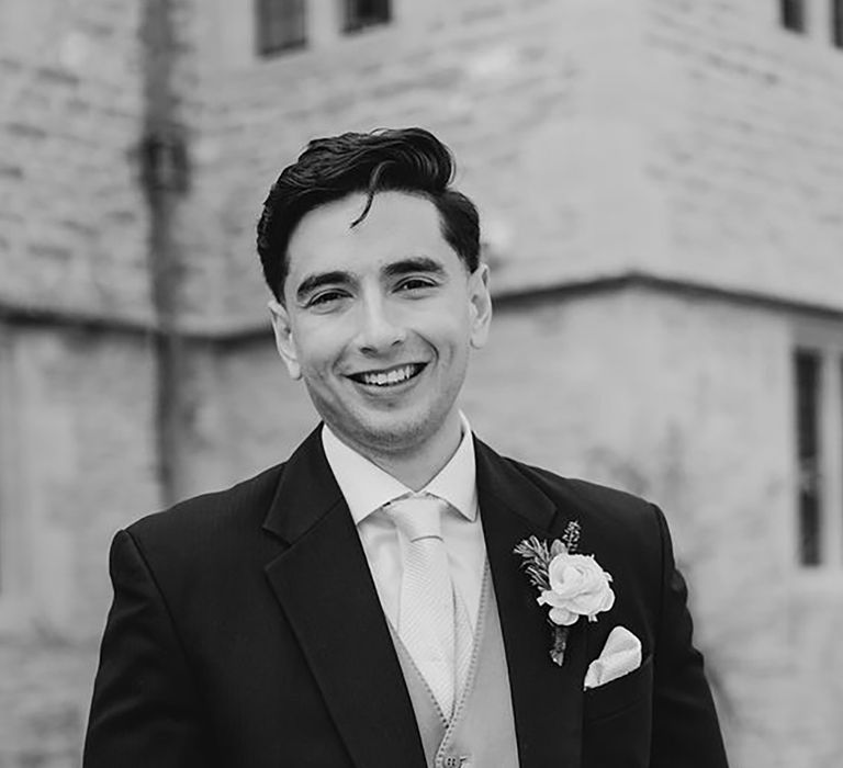 groom wearing traditional morning suit on wedding day