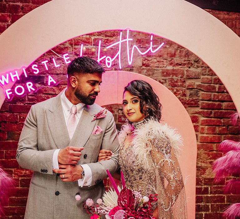 bride-and-groom-at-pink-south-asian-wedding