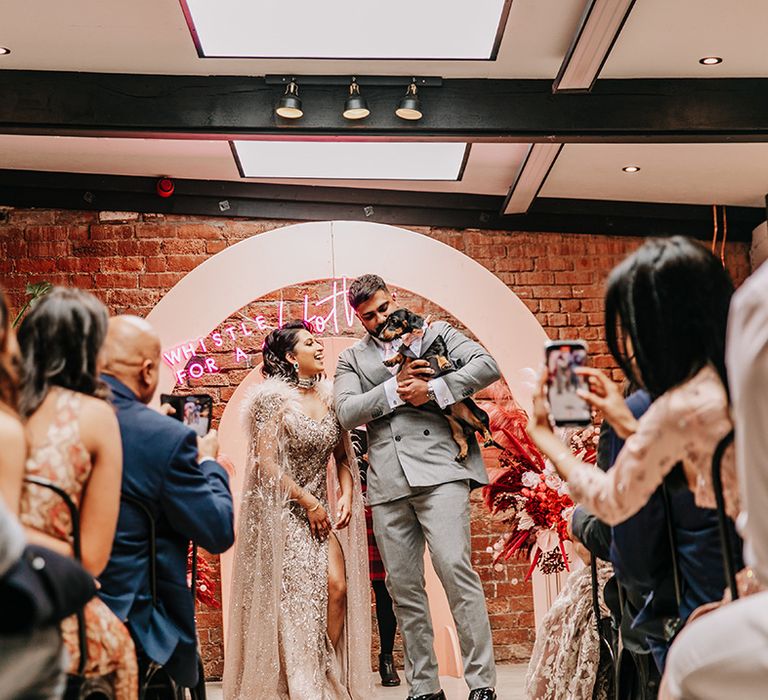 bride-and-groom-walk-back-down-the-aisle-at-wedding