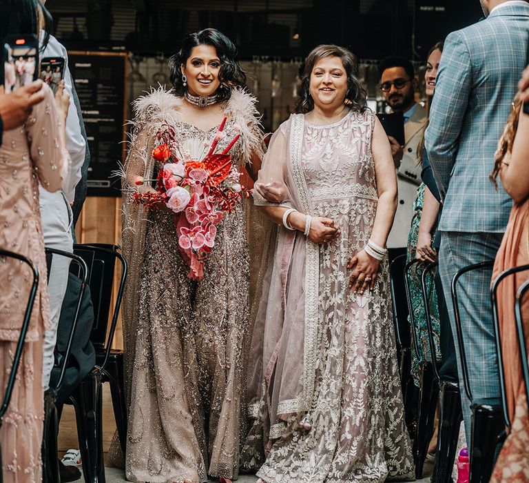 bride-walks-down-aisle-with-mother-of-the-bride