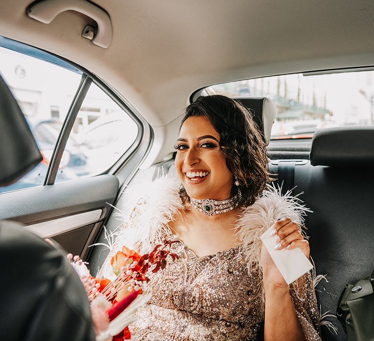 bride-wearing-diamond-statement-choker-necklace-in-wedding-car