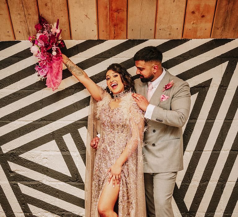 groom-in-light-grey-suit-with-bride-in-sparkly-wedding-dress