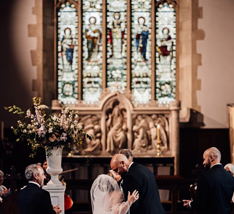 bride-and-groom-share-first-kiss-as-married-couple