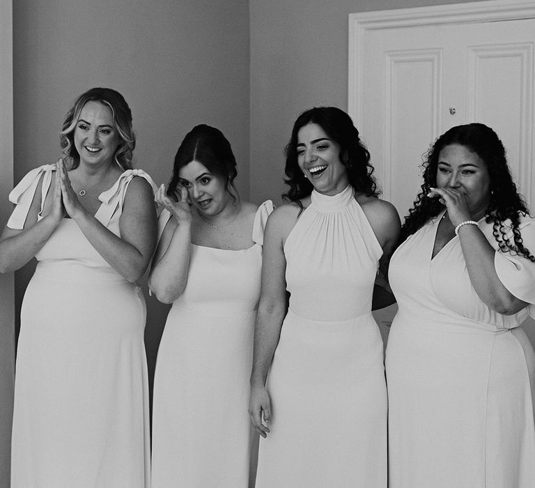 bridesmaids-in-pale-pink-bridesmaid-dresses-get-first-look-at-bride