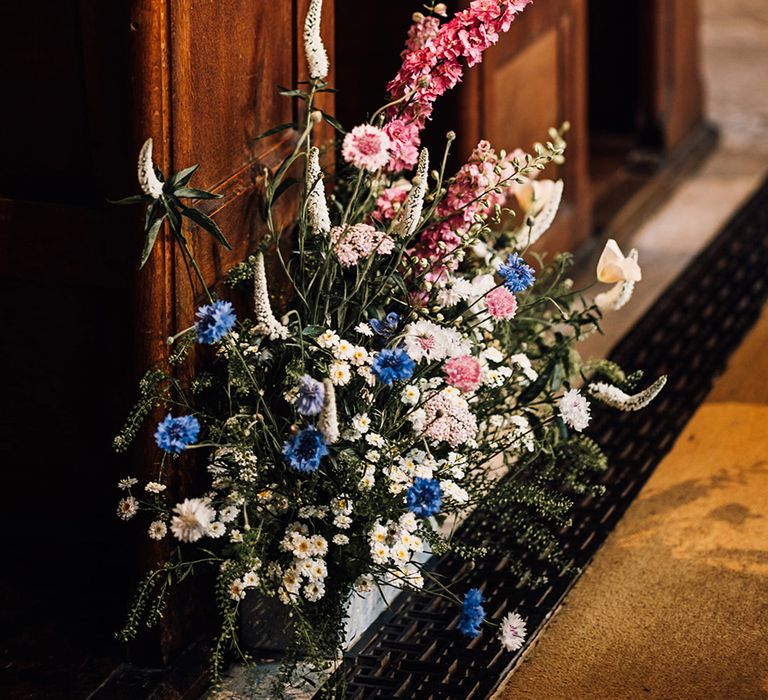 pink-and-blue-meadow-aisle-flowers