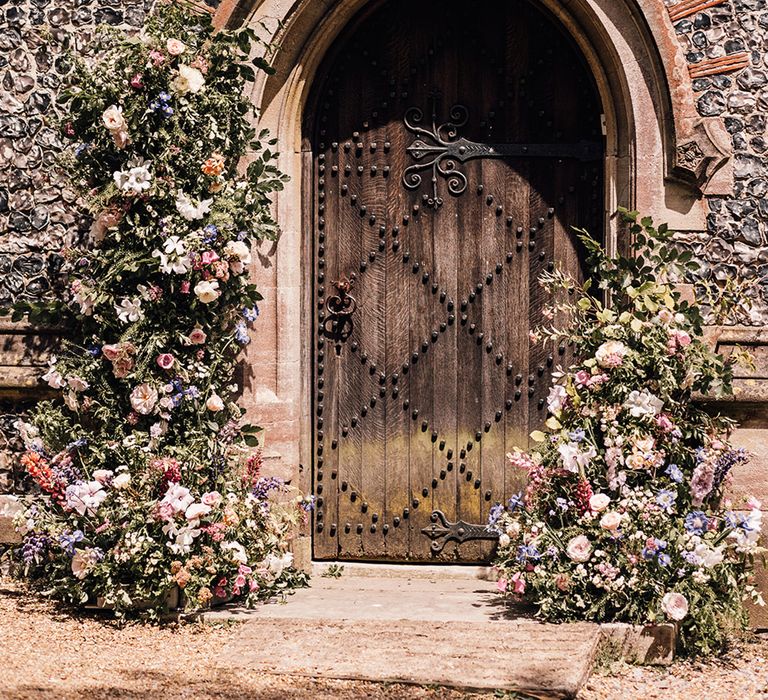 wildflower-wedding-flower-column-decorations-at-church-entrance